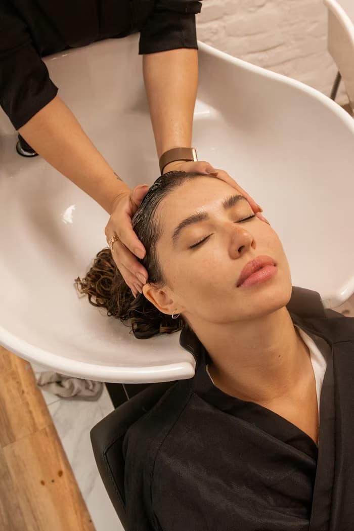 Woman relaxing at spa with face mask